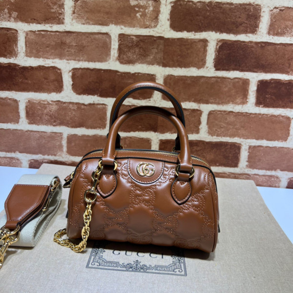 G*u*i gg matelassé leather top handle bag
