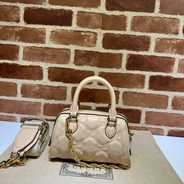 G*u*i gg matelassé leather top handle bag