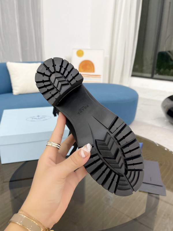 Pra*a brushed leather and nylon laced booties